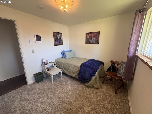 carpeted bedroom with baseboards