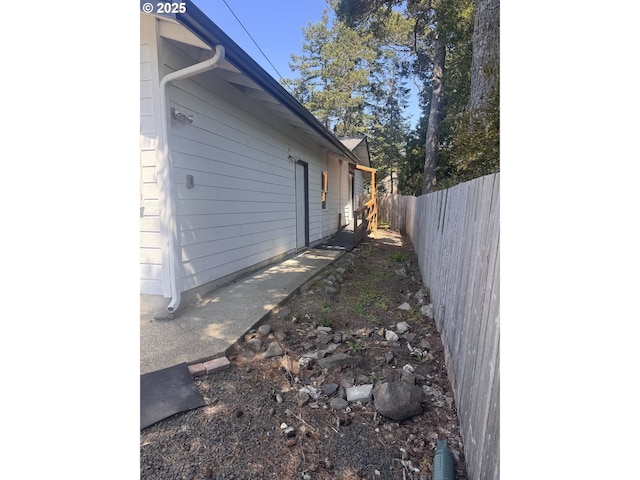 view of home's exterior with fence