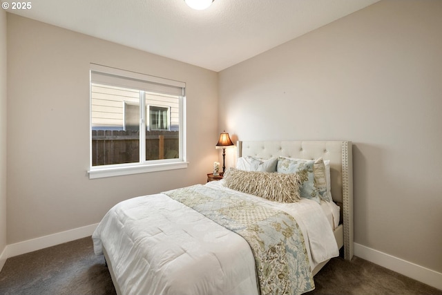 carpeted bedroom with baseboards