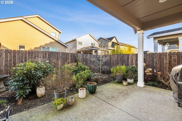 view of patio featuring fence