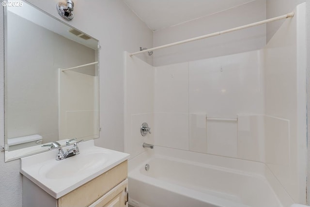 full bathroom with  shower combination, vanity, and toilet