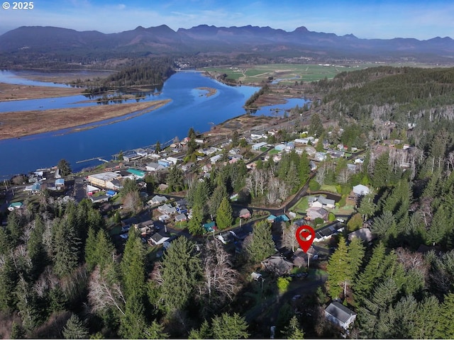 bird's eye view featuring a water and mountain view