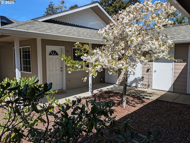 1150 Hemlock St E Unit 17, Florence, OR 97439 - doorway to property featuring a shingled roof