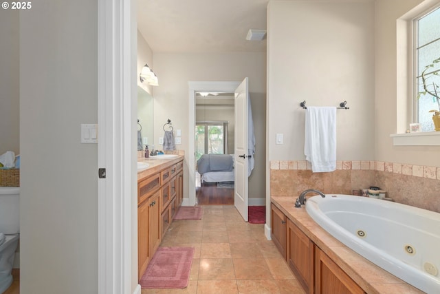 2610 Crowther Dr, Eugene, OR 97404 - bathroom featuring healthy amount of natural light, a whirlpool tub, vanity, and ensuite bath