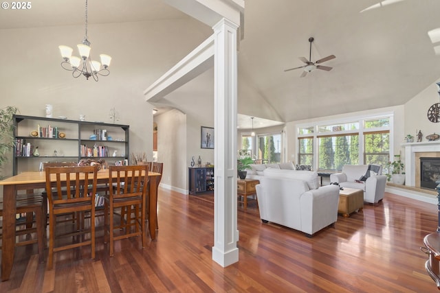 2610 Crowther Dr, Eugene, OR 97404 - living area with high vaulted ceiling, ceiling fan, wood finished floors, decorative columns, and a tile fireplace