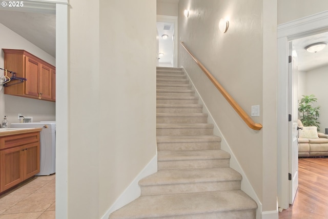 2610 Crowther Dr, Eugene, OR 97404 - stairway with baseboards and washer / clothes dryer