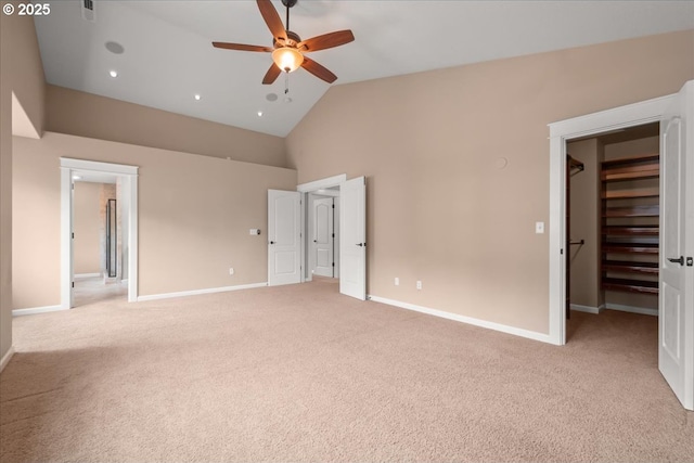 4538 Y St, Washougal, WA 98671 - unfurnished bedroom featuring light carpet, high vaulted ceiling, a spacious closet, baseboards, and ceiling fan