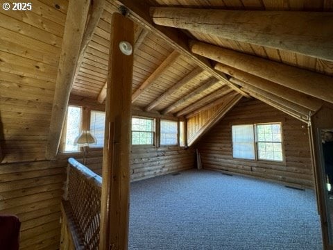 unfinished attic featuring plenty of natural light