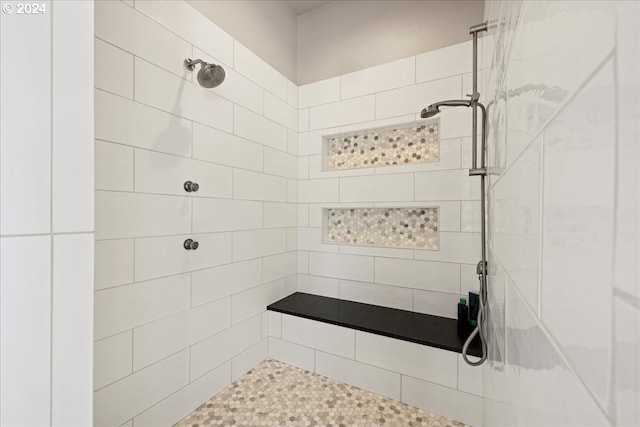bathroom featuring a tile shower