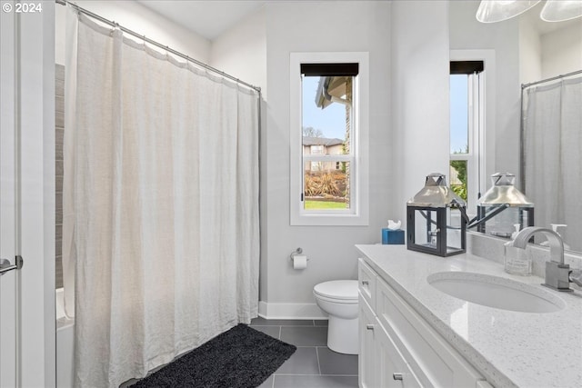 bathroom with tile patterned flooring, baseboards, toilet, and vanity