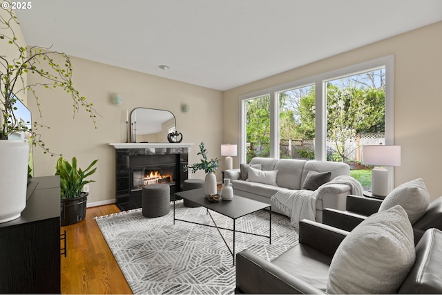 5153 Greensborough Ct, Lake Oswego, OR 97035 - living area featuring a tile fireplace, wood finished floors, and baseboards