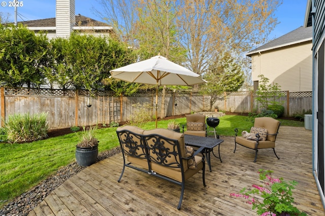 view of patio / terrace with a fenced backyard and a wooden deck