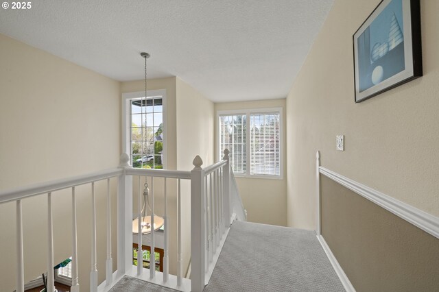 5153 Greensborough Ct, Lake Oswego, OR 97035 - hallway with an upstairs landing, baseboards, a textured ceiling, and carpet flooring