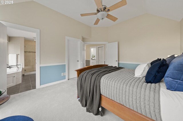5153 Greensborough Ct, Lake Oswego, OR 97035 - tiled bedroom featuring carpet, lofted ceiling, ceiling fan, connected bathroom, and baseboards