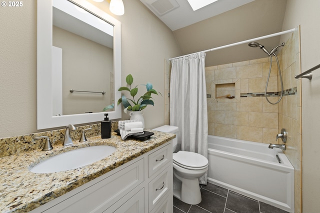 full bath with vanity, visible vents, toilet, tile patterned flooring, and shower / bath combo with shower curtain