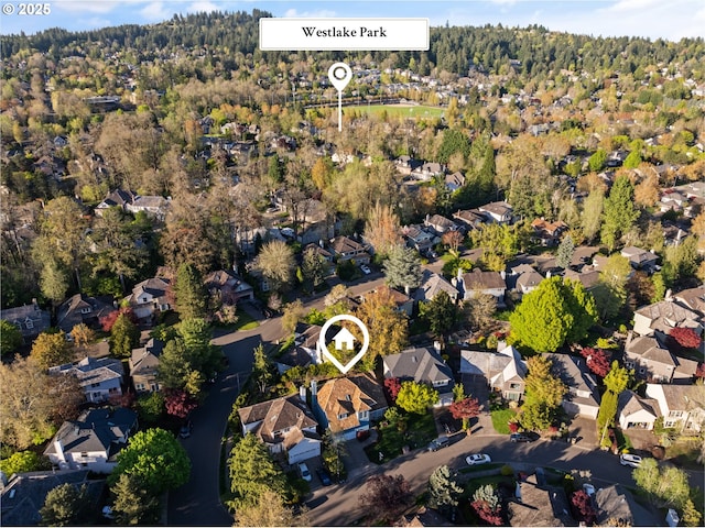 bird's eye view with a residential view and a view of trees