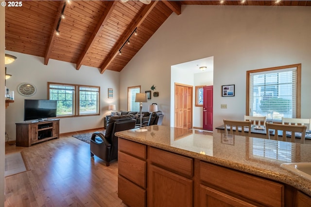 1312 Village Loop, Bandon, OR 97411 - kitchen featuring track lighting, a wood ceiling with exposed beams, light wood finished floors, high vaulted ceiling, and open floor plan