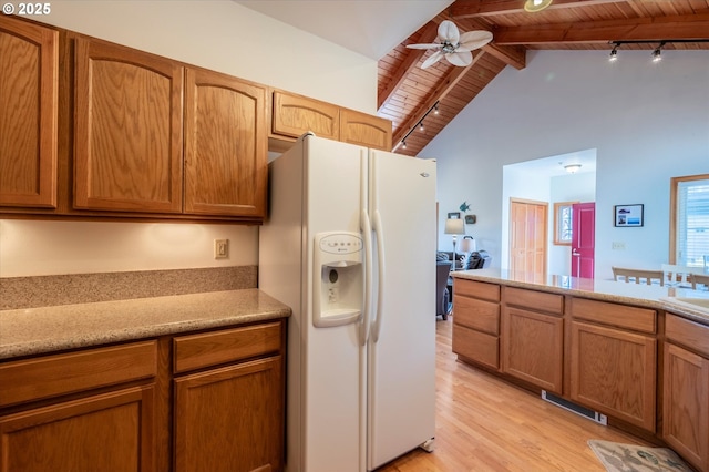 1312 Village Loop, Bandon, OR 97411 - kitchen featuring white refrigerator with ice dispenser, a wood ceiling with exposed beams, light wood-style flooring, ceiling fan, and track lighting