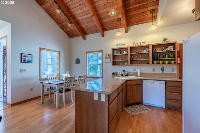 1312 Village Loop, Bandon, OR 97411 - kitchen with white appliances, a wood ceiling with exposed beams, open shelves, light wood-style flooring, and brown cabinetry