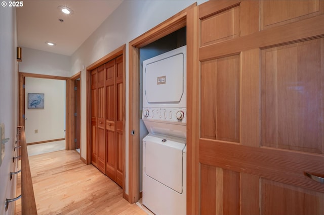 1312 Village Loop, Bandon, OR 97411 - laundry room with stacked washing machine and dryer, light wood-type flooring, and recessed lighting
