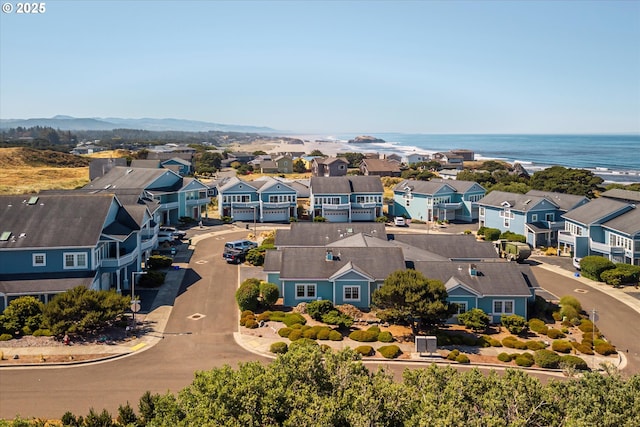 1312 Village Loop, Bandon, OR 97411 - aerial perspective of suburban area with a large body of water