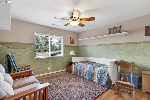 bedroom featuring hardwood / wood-style flooring and ceiling fan