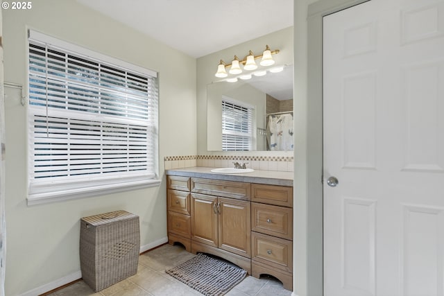 bathroom with vanity, tile patterned floors, and walk in shower