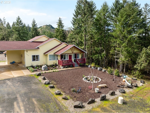 1260 Ireland Rd, Winston, OR 97496 - view of front facade featuring an attached carport and driveway