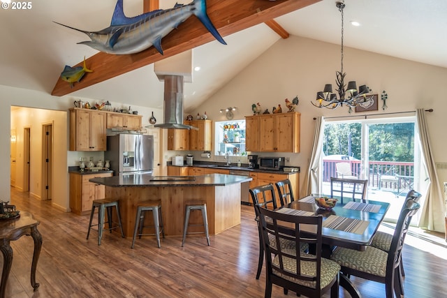 1260 Ireland Rd, Winston, OR 97496 - kitchen with a kitchen island, island exhaust hood, dark countertops, and appliances with stainless steel finishes