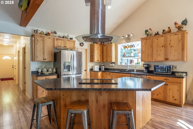 1260 Ireland Rd, Winston, OR 97496 - kitchen featuring island exhaust hood, a breakfast bar, dark countertops, appliances with stainless steel finishes, and a sink