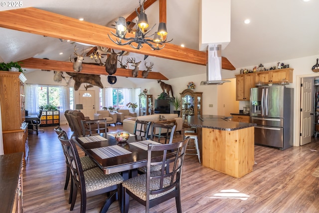 1260 Ireland Rd, Winston, OR 97496 - dining room featuring light wood-style flooring, high vaulted ceiling, a notable chandelier, and beam ceiling