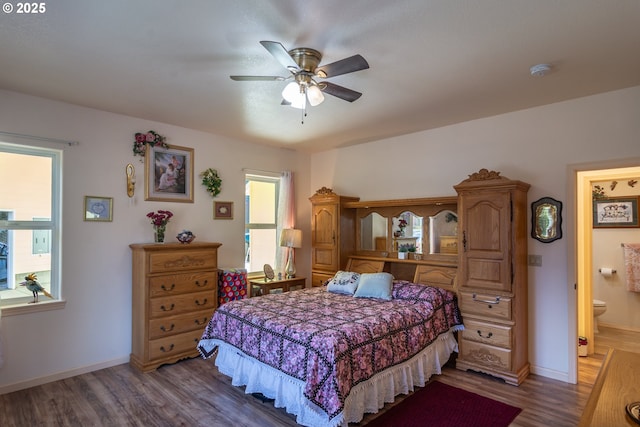 1260 Ireland Rd, Winston, OR 97496 - bedroom featuring baseboards, wood finished floors, and ceiling fan