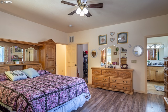 1260 Ireland Rd, Winston, OR 97496 - bedroom with a closet, visible vents, a spacious closet, and wood finished floors