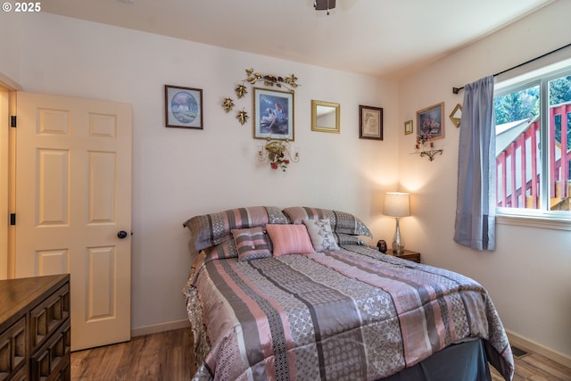 1260 Ireland Rd, Winston, OR 97496 - bedroom with baseboards and wood finished floors