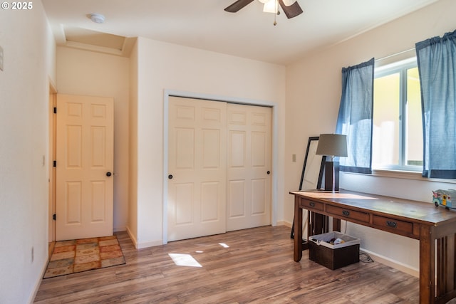 1260 Ireland Rd, Winston, OR 97496 - office with baseboards, ceiling fan, and wood finished floors