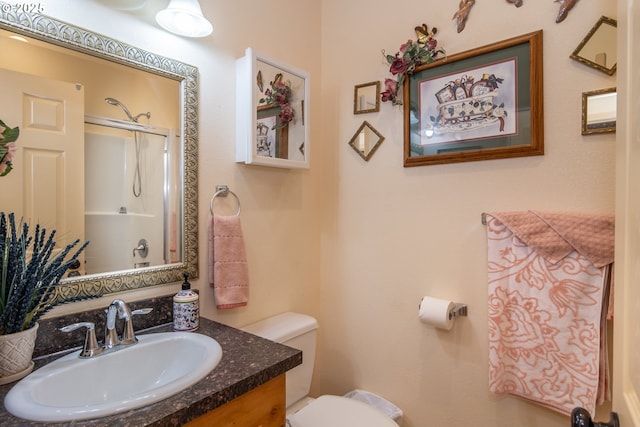 1260 Ireland Rd, Winston, OR 97496 - full bathroom with toilet, vanity, and a shower with shower door