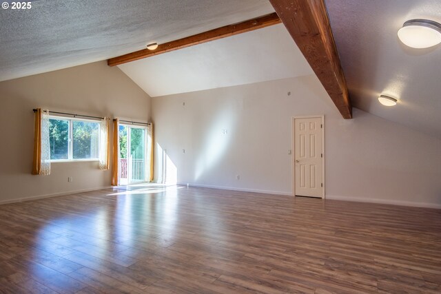1260 Ireland Rd, Winston, OR 97496 - interior space featuring a textured ceiling, beamed ceiling, and wood finished floors
