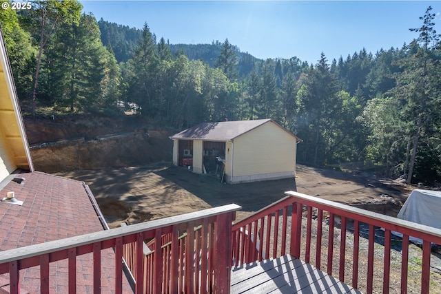1260 Ireland Rd, Winston, OR 97496 - deck with an outdoor structure and a view of trees