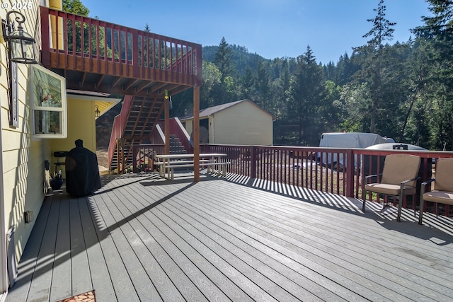 1260 Ireland Rd, Winston, OR 97496 - wooden deck with stairs and a wooded view