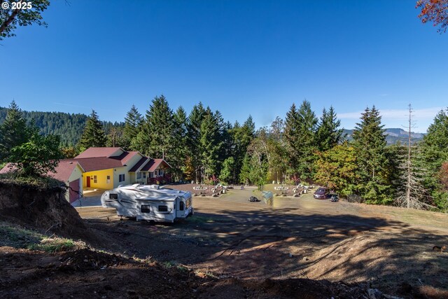 1260 Ireland Rd, Winston, OR 97496 - view of yard featuring a wooded view