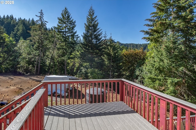 1260 Ireland Rd, Winston, OR 97496 - wooden terrace featuring an outdoor structure and a forest view