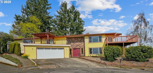 3457 Champlain Ct, Salem, OR 97304 - view of front of property featuring stucco siding, driveway, a garage, and a balcony