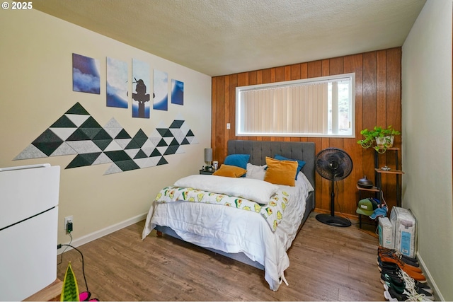 3457 Champlain Ct, Salem, OR 97304 - bedroom featuring wood walls, baseboards, and wood finished floors