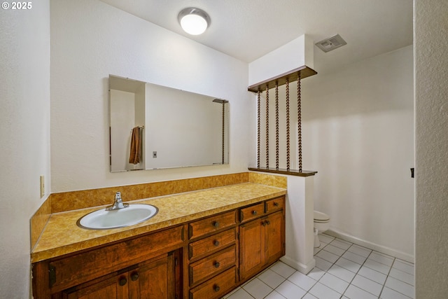 3457 Champlain Ct, Salem, OR 97304 - bathroom with toilet, visible vents, tile patterned flooring, and vanity