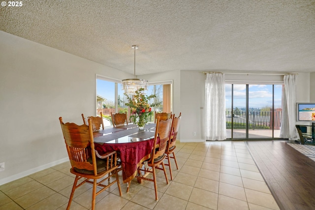 3457 Champlain Ct, Salem, OR 97304 - dining space with an inviting chandelier, a wealth of natural light, baseboards, and light tile patterned floors