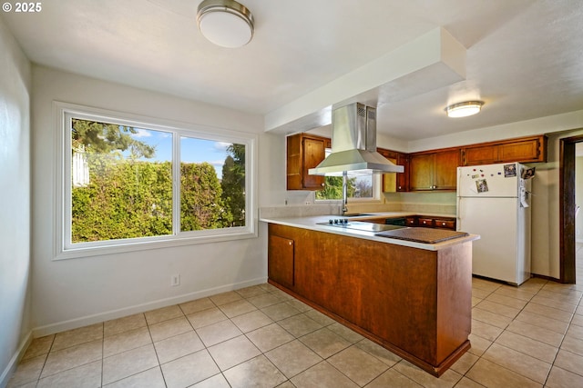 3457 Champlain Ct, Salem, OR 97304 - kitchen featuring freestanding refrigerator, a wealth of natural light, a peninsula, and island range hood