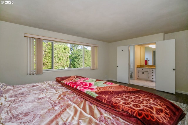 3457 Champlain Ct, Salem, OR 97304 - bedroom with ensuite bathroom, baseboards, and wood finished floors