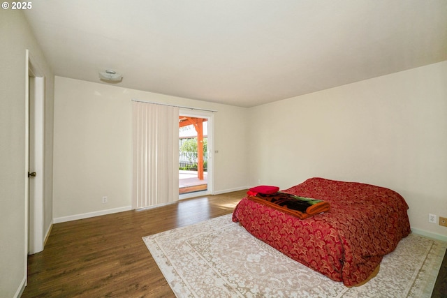 3457 Champlain Ct, Salem, OR 97304 - bedroom featuring access to outside, baseboards, and dark wood finished floors