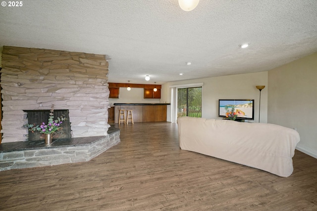 3457 Champlain Ct, Salem, OR 97304 - unfurnished living room with a textured ceiling and wood finished floors