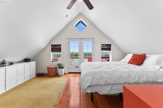 bedroom featuring access to exterior, light wood-style floors, lofted ceiling, and ceiling fan